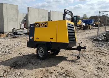 500 CFM heavy-duty diesel air compressor operating at a large construction site