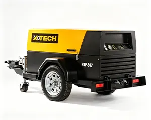 185 CFM diesel air compressor powering pneumatic tools at a construction site