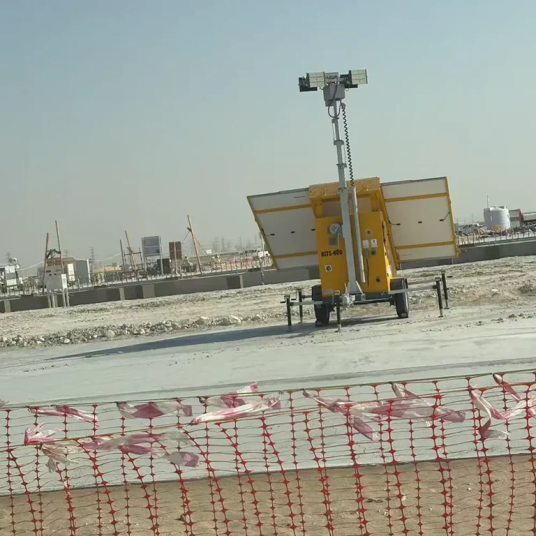 Kotech KLT Series mobile diesel light tower illuminating a Saudi construction site at night, with four LED lamp heads mounted on an extended mast.